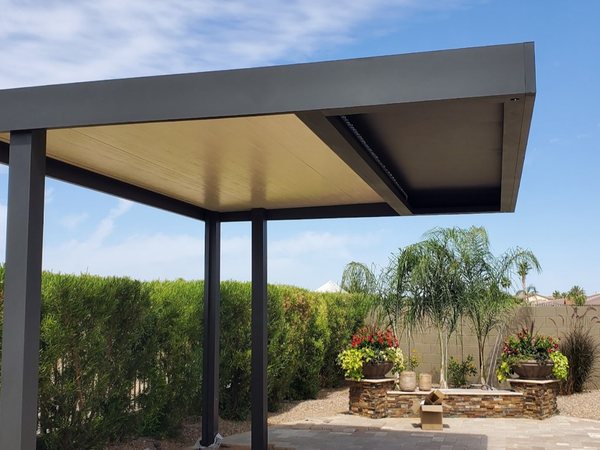 Freestanding dark aluminum solid patio cover example for Las Vegas area backyards.