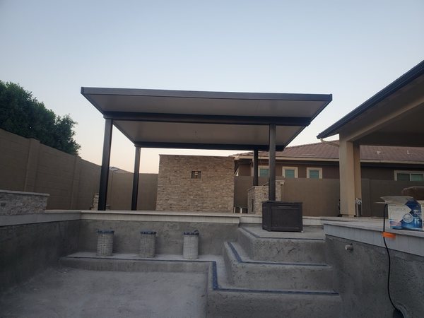 Dark solid aluminum backyard patio cover for Las Vegas area outdoor living.