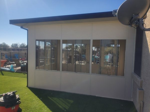 Covered patio room and shade structure example for Henderson area homes.