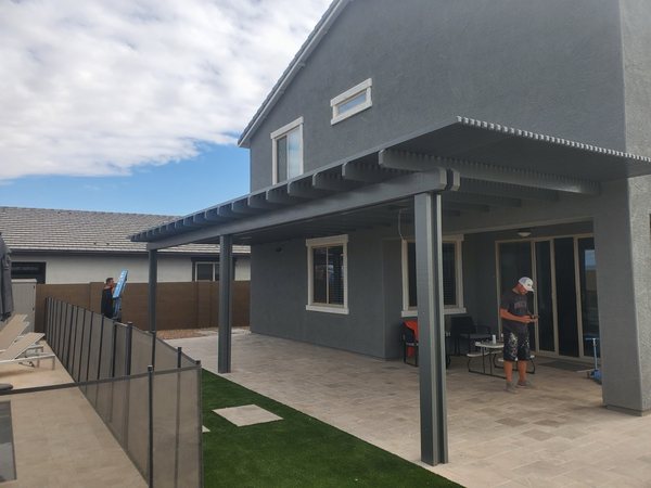 Attached dark aluminum patio cover for Green Valley area outdoor living spaces.