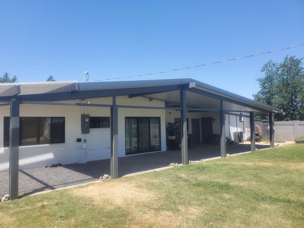 Long attached aluminum patio cover for Henderson area rear patios.
