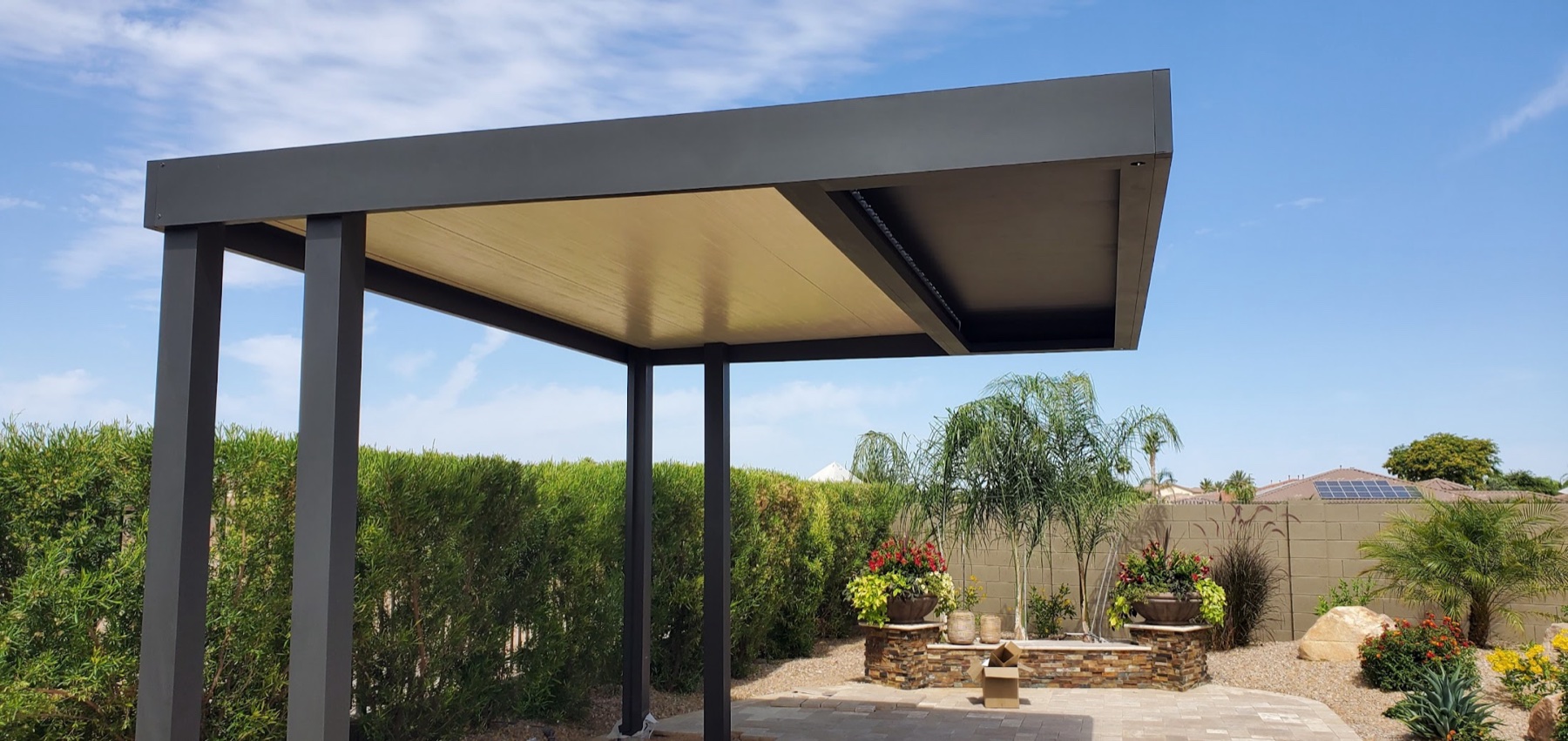 Freestanding dark aluminum solid patio cover example for Las Vegas area backyards.