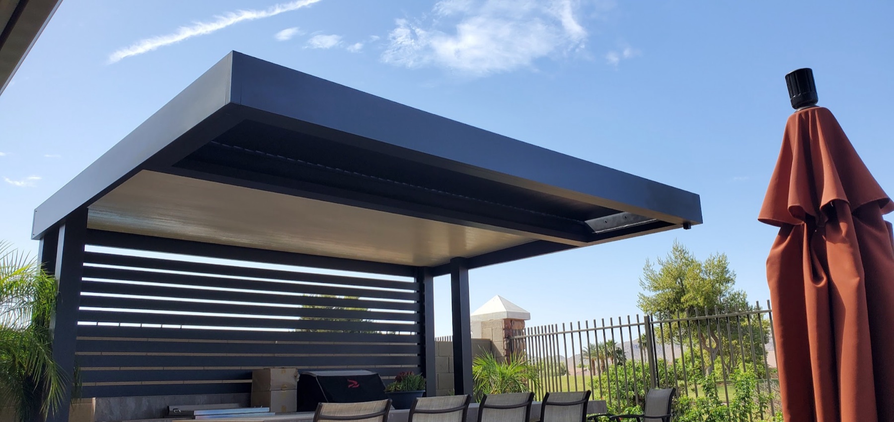 Modern aluminum shade cover with privacy wall for North Las Vegas area homes.