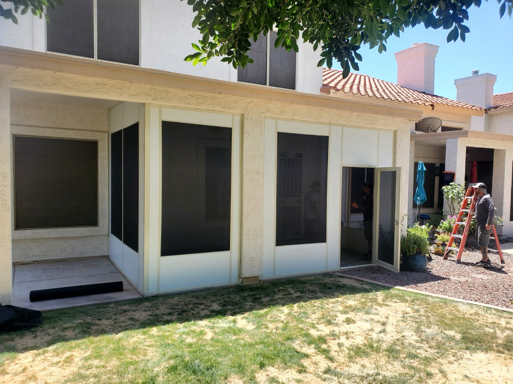 Attached white patio cover installation for North Las Vegas area homeowners.