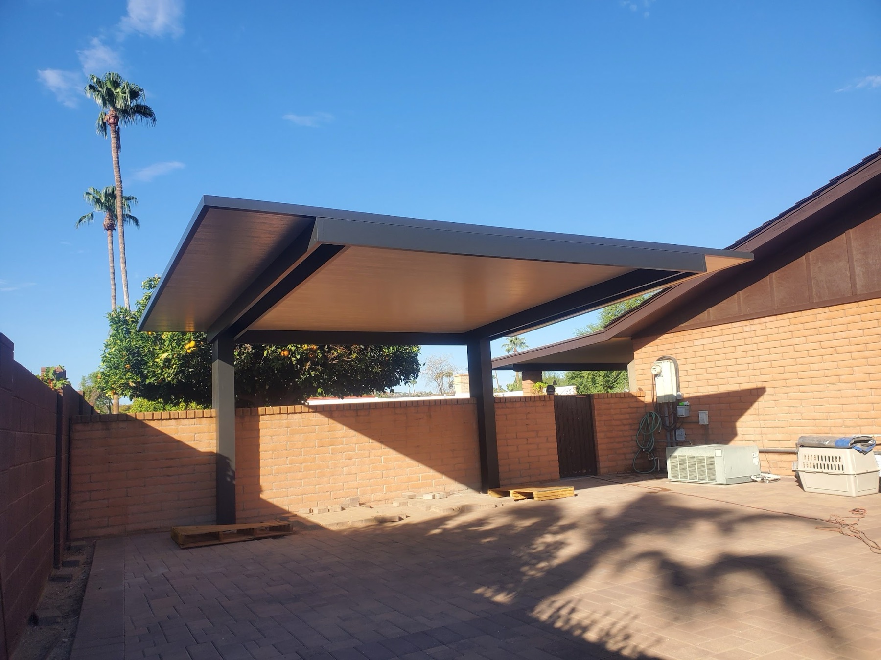 Long attached solid aluminum patio cover for Las Vegas area side yards.