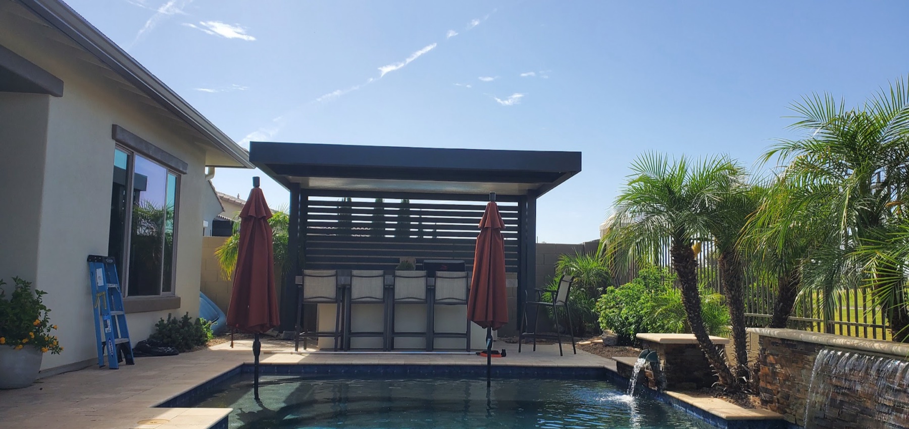 Poolside patio cover with privacy screen for Lake Las Vegas area homes.