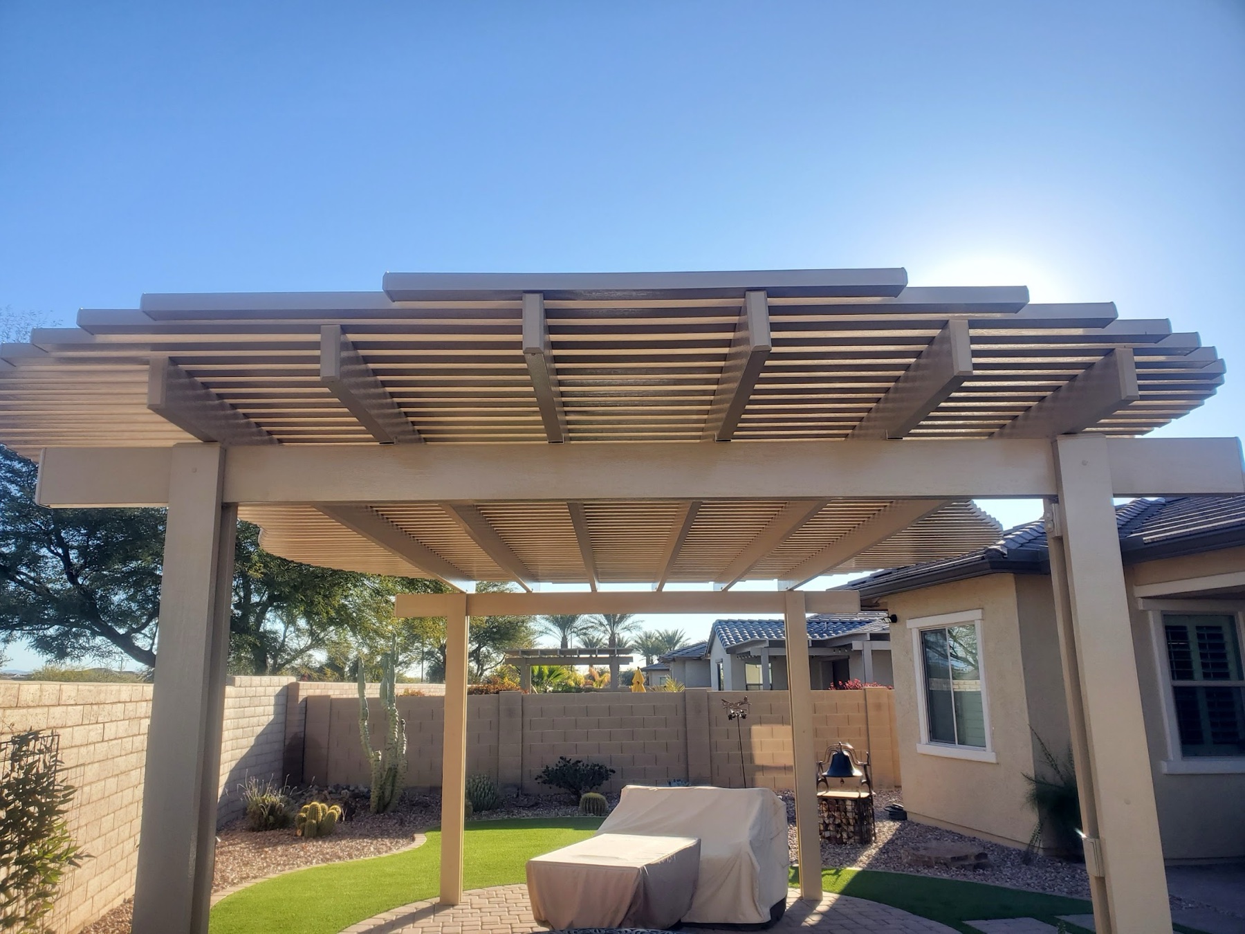 Tan lattice outdoor room patio cover for Anthem area homeowners.