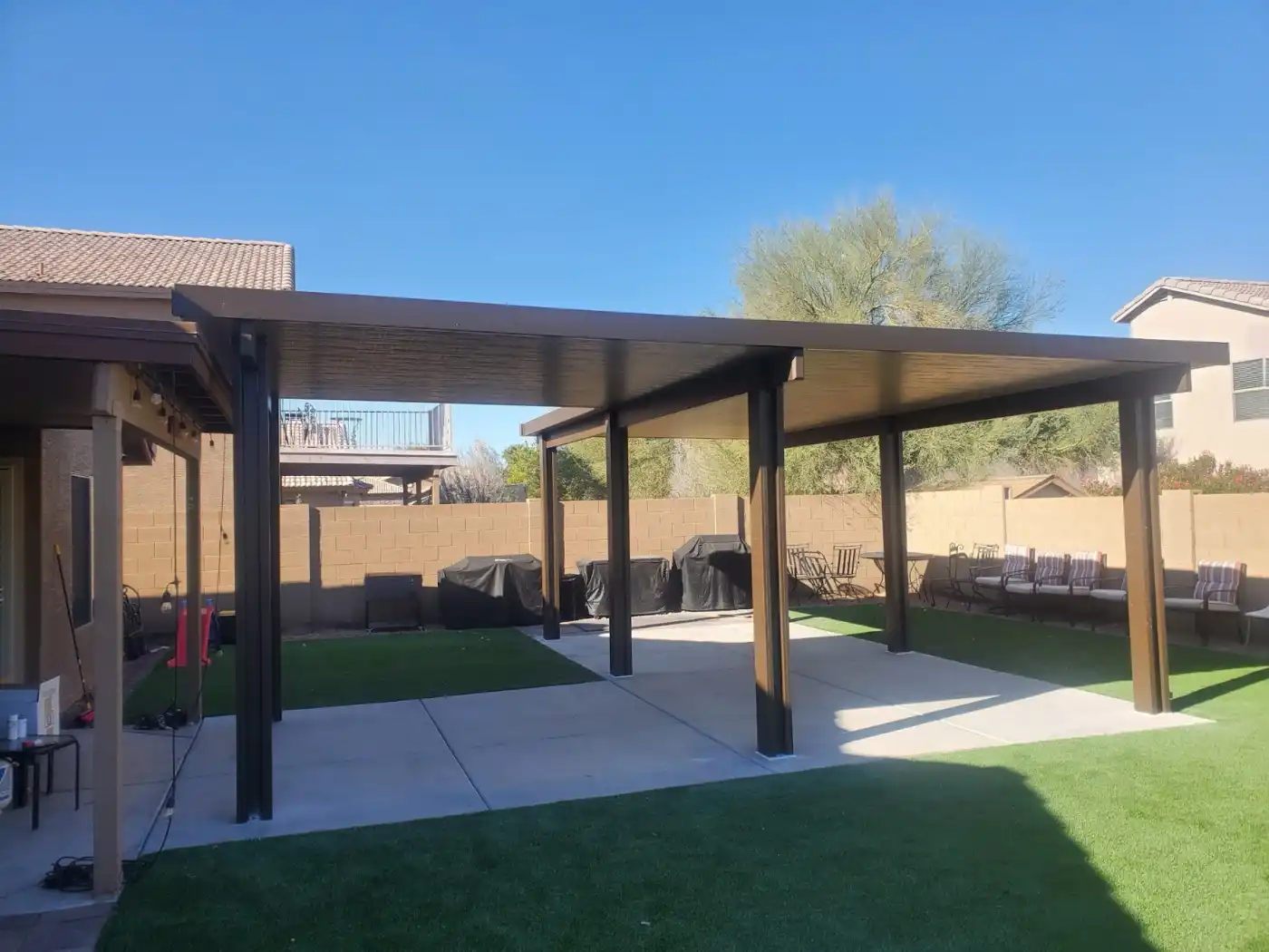 Large freestanding patio cover installed by City Seamless in a Southern Nevada backyard